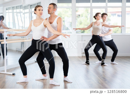 Young man and young woman rehearsing pair ballet 128516800