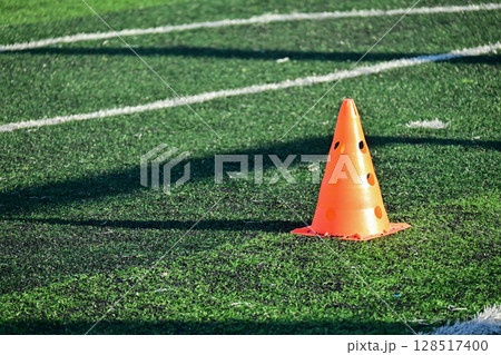 artificial green grass soccer field with orange training cones artificial green grass soccer field with orange training cones 128517400