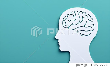 The image shows a white paper cutout of a human head on a teal background, emphasizing mindfulness and emotional balance The image shows a white paper cutout of a human head on a teal background, emphasizing mindfulness and emotional balance 128517775