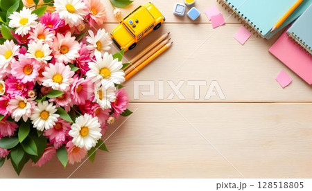 A wooden background with spring flowers and school supplies, reflecting themes of education, mentorship, and teacher appreciation 128518805