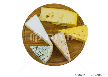 Set of various types of cheese on wooden cutting board isolated on white background. Top view 128520696