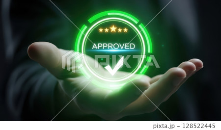 Human hand holding a glowing green approved symbol with checkmark and rating stars Human hand holding a glowing green approved symbol with checkmark and rating stars 128522445