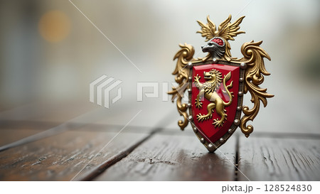 Elegant medieval heraldic shield with golden lion emblem presented on a rustic wooden surface 128524830