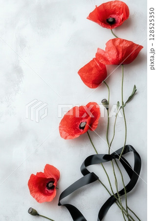Red Poppies on Light Background with Black Ribbon 128525350