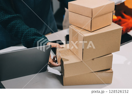 Portrait of Starting small businesses SME owners, two Asian woman check online orders Selling products working with boxs freelance work at home office, sme business online small medium enterprise Portrait of Starting small businesses SME owners, two Asian woman check online orders Selling products working with boxs freelance work at home office, sme business online small medium enterprise 128526152