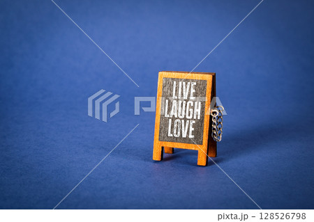 Live Laugh Love. Mini Chalkboard with Inspirational Message on Blue Background 128526798
