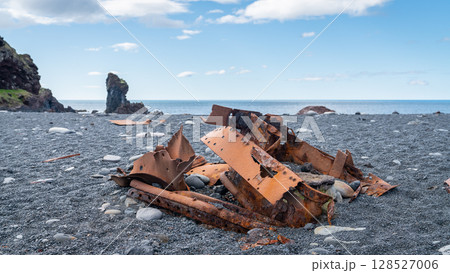 Rusty remains of a shipwreck lie scattered on Djupalonssandur beach, Snaefellsjokull National Park, Iceland. Rusty remains of a shipwreck lie scattered on Djupalonssandur beach, Snaefellsjokull National Park, Iceland. 128527006