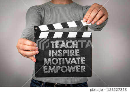 Motivational Message on Clapperboard Encouraging to Teach, Inspire, Motivate, and Empower Others 128527258