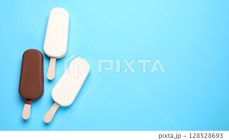 Isolated chocolate ice cream on a stick, a sweet vector icon illustration on a blue background Isolated chocolate ice cream on a stick, a sweet vector icon illustration on a blue background 128528693