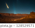 Comet flying over Canyonlands National Park in Utah, USA at night, stunning celestial event above rugged landscape 128529571