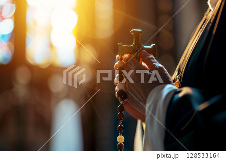 A man holds a cross in his hands and prays intently in a Christian church, AI generation 128533164