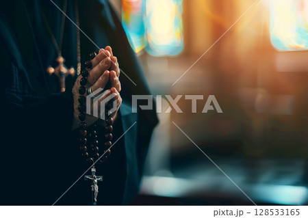 A man holds a cross in his hands and prays intently in a Christian church, AI generation 128533165