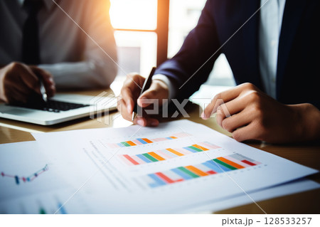 business people analysis cost graph on desk at office with generative ai 128533257
