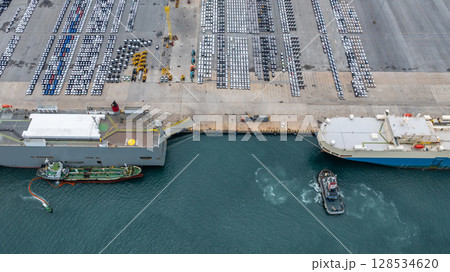 Aerial view vehicles carrier and new cars for import export transportation logistic, Vehicles carrier at industrial RoRo terminal port, Vehicles carrier global business logistic import export new car 128534620