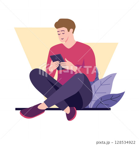Boy Sitting on the Ground Scrolling Through Social Media Boy Sitting on the Ground Scrolling Through Social Media 128534922