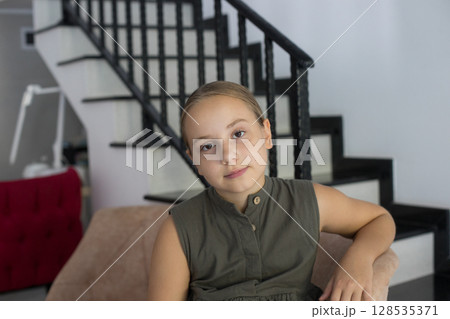 Adorable child girl looking at home, indoor portrait Adorable child girl looking at home, indoor portrait 128535371