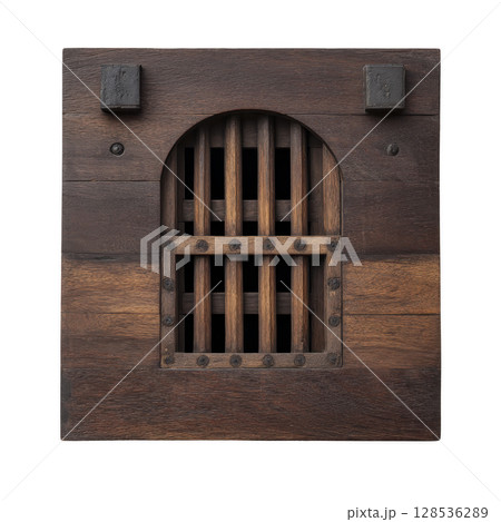 Rustic wooden door with arched barred window, featuring dark metal accents and weathered finish, evokes sense of history and mystery 128536289