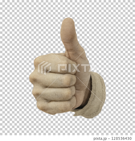 Hand wearing beige glove gives thumbs up gesture, symbolizing approval or agreement. glove has textured fabric appearance, adding rustic feel to image 128536430
