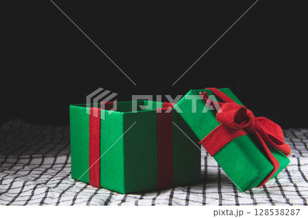 Box with a New Year's gift. Christmas pictures. Open box with a gift. 128538287