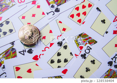 Casino and bitcoin. Chips in the form of bitcoins on the poker table. Casino and bitcoin. Chips in the form of bitcoins on the poker table. 128538404