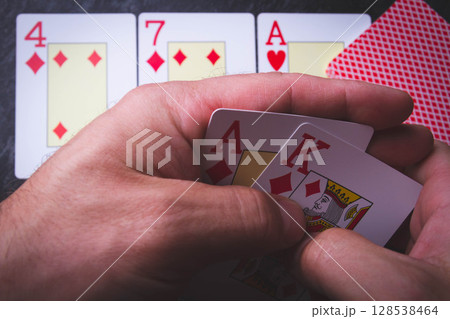 Poker cards.Full house in hand. Card game. 128538464
