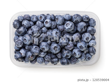Blueberries in a plastic box on a white background. Top view Blueberries in a plastic box on a white background. Top view 128539004