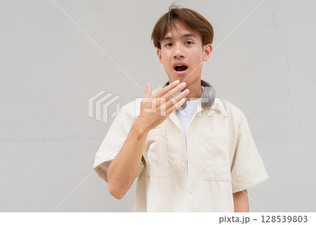 Non binary person with surprised omg shocked disbelief expression 128539803