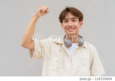 Person with fist and arm raised portrait Person with fist and arm raised portrait 128539804