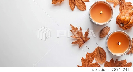Autumn Flat Lay with Pumpkins, Candles, and Leaves 128541241