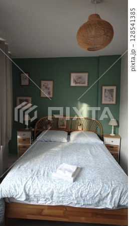 Relaxing bedroom retreat with soft colors and natural decor inviting peaceful slumber Relaxing bedroom retreat with soft colors and natural decor inviting peaceful slumber 128541385