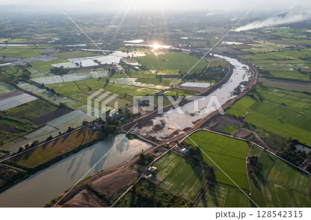 Construction dredges up for a canal and dam, to prevent a flood in the rainy season. Date on 14 May 2021 at Uthai Thani province, Thailand. Construction dredges up for a canal and dam, to prevent a flood in the rainy season. Date on 14 May 2021 at Uthai Thani province, Thailand. 128542315