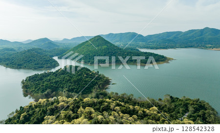 Kaeng Krachan dam with lake view and many green moutain, blue sky background. Kaeng Krachan Dam national park, Phetchaburi province, Thailand in aerial view from drone. 128542328