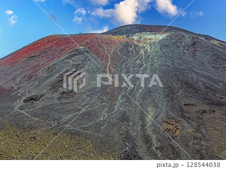 Lava rocks and peak of Mount Ngauruhoe Lava rocks and peak of Mount Ngauruhoe 128544038