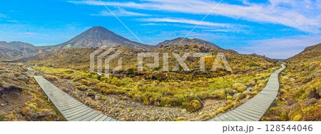Tongariro boardwalk trail with wide sky view Tongariro boardwalk trail with wide sky view 128544046