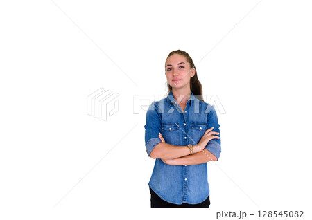 Portrait of beautiful woman in blue jeans shirt, crossed arms posing and standing on white background with copy space. Looking at camera. 128545082
