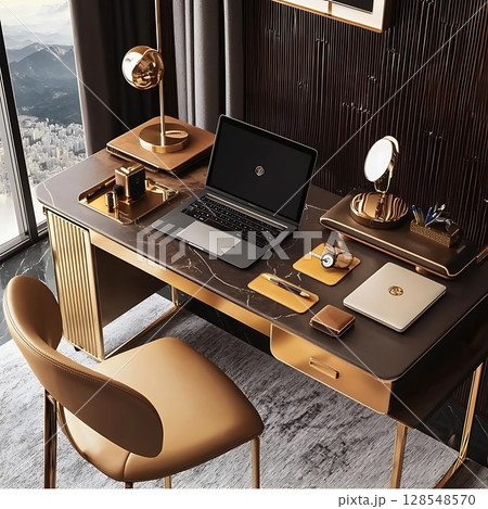 A desk with a laptop and a laptop mouse on it 128548570