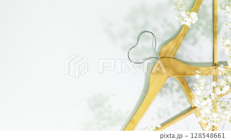 Creative spring shopping and sale concept. Wooden hangers in shape of heart with white spring flowers on blue background. Fashion spring discounts shopping, sale store. Flat lay, copy space Creative spring shopping and sale concept. Wooden hangers in shape of heart with white spring flowers on blue background. Fashion spring discounts shopping, sale store. Flat lay, copy space 128548661