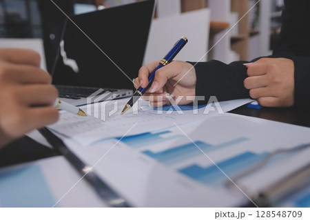 Team of business people working together in the meeting room office,teamwork background charts and graphs banner, double exposure successful teamwork,business planning concept. Team of business people working together in the meeting room office,teamwork background charts and graphs banner, double exposure successful teamwork,business planning concept. 128548709