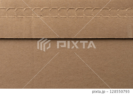 Brown paper envelope with stitched edge lying flat on smooth surface Brown paper envelope with stitched edge lying flat on smooth surface 128550793