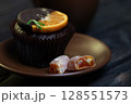 Chocolate cupcake with orange slice and Turkish delight 128551573
