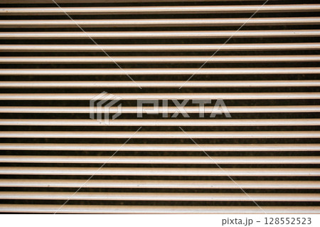 Close up of a metal grille as a background or texture. Close up of a metal grille as a background or texture. 128552523