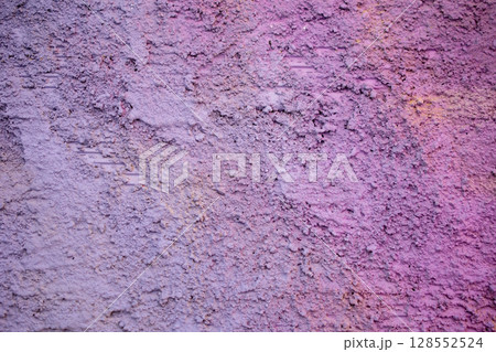 Texture of old rustic wall covered with purple stucco. Abstract background for design. Texture of old rustic wall covered with purple stucco. Abstract background for design. 128552524