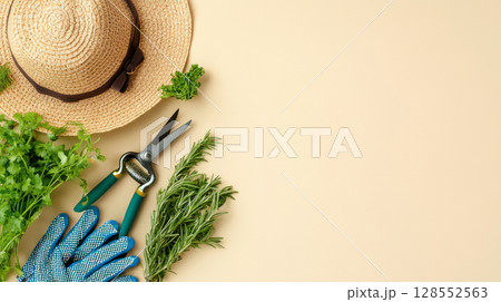Minimal garden lifestyle setup with tools and greenery on soft neutral background. 128552563