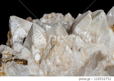 Macro mineral stone Snow quartz with calcite on a black background Macro mineral stone Snow quartz with calcite on a black background 128552752