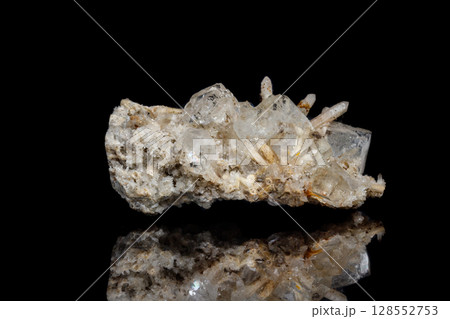 Macro mineral stone fluorite with quartz against black background Macro mineral stone fluorite with quartz against black background 128552753
