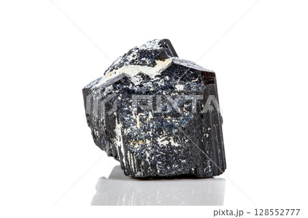 macro mineral stone sherle, schorl, black tourmaline on white background 128552777