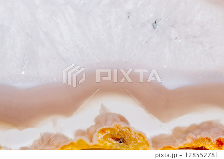 Macro mineral orange agate in crystals on white background 128552781