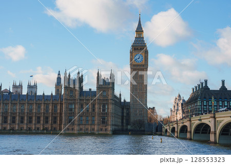 View of Big Ben and the Houses of Parliament in London, England, with the River Thames in the foreground and Westminster Bridge on the right. View of Big Ben and the Houses of Parliament in London, England, with the River Thames in the foreground and Westminster Bridge on the right. 128553323