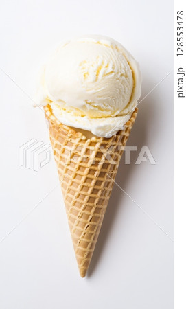 Tasty summer treat - vanilla ice cream cone with creamy texture and crispy edge, minimalist layout for product or banner use. 128553478