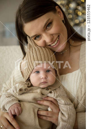 A woman holding a baby A woman holding a baby 128555462